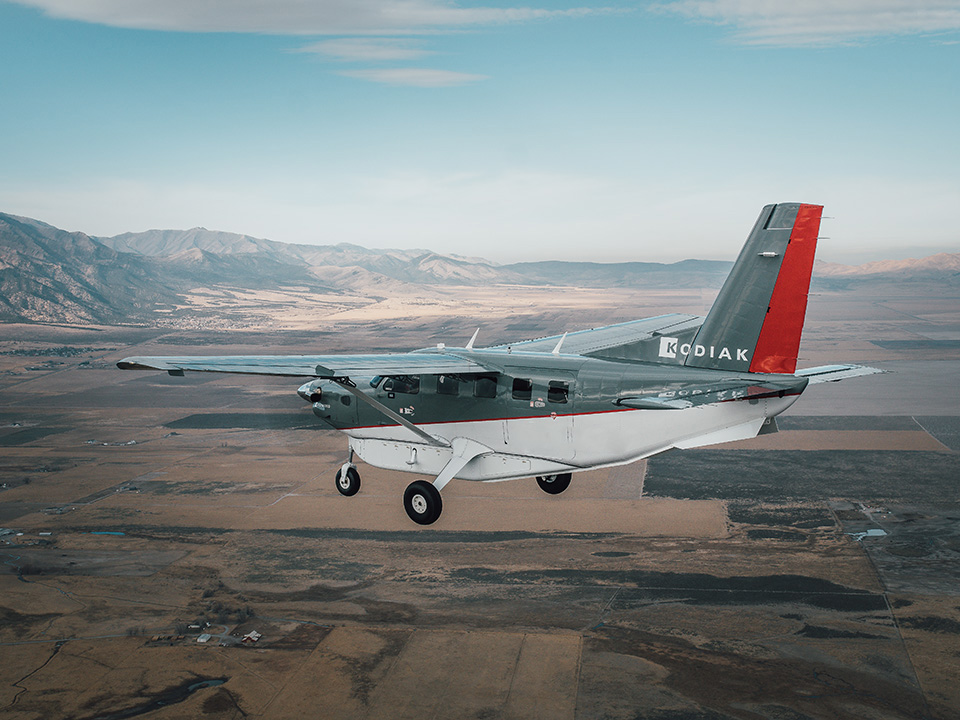 A Kodiak 100 short takeoff and landing aircraft ferries two motorcycles